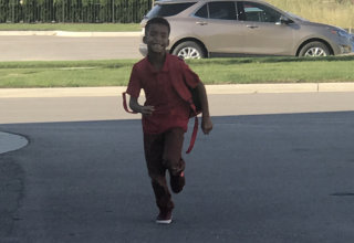 boy running down the street